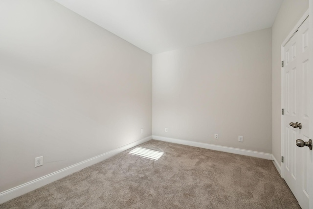 empty room with light colored carpet