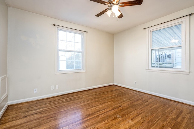 unfurnished room with ceiling fan and hardwood / wood-style floors