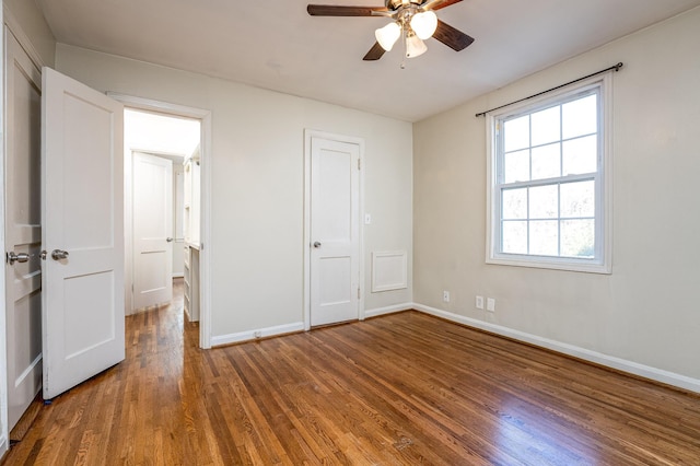 unfurnished bedroom with ceiling fan and hardwood / wood-style floors