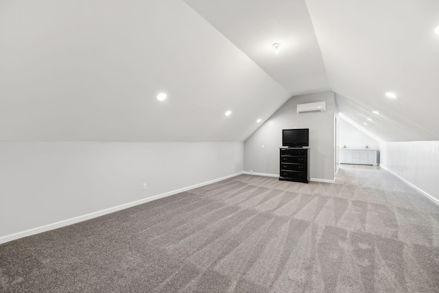 additional living space featuring lofted ceiling, light colored carpet, and a wall mounted AC