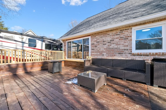 wooden deck with an outdoor hangout area