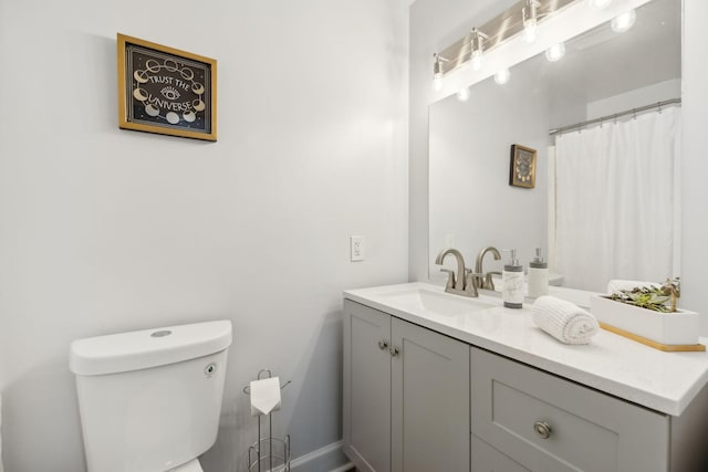 bathroom with toilet and vanity