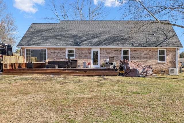 rear view of house featuring a wooden deck, ac unit, and a lawn