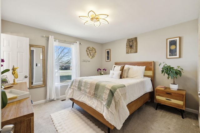 bedroom featuring light carpet