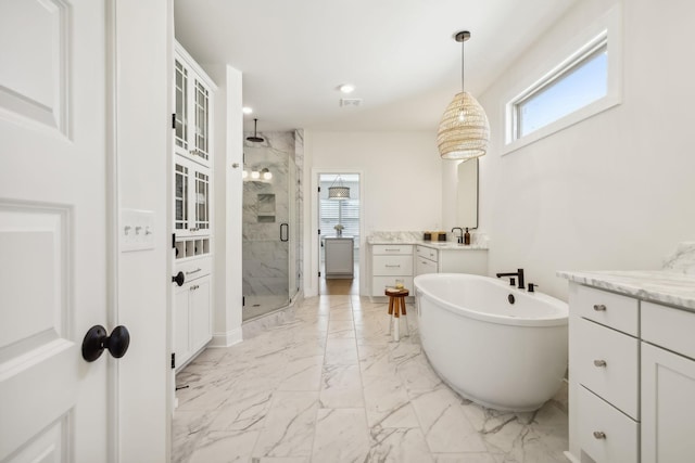 bathroom featuring vanity and plus walk in shower