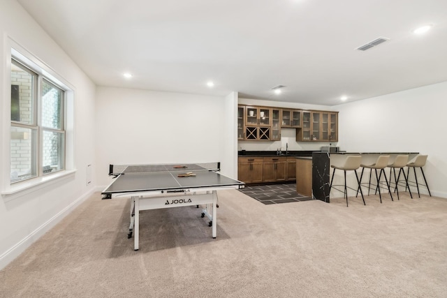 playroom with bar area and dark carpet