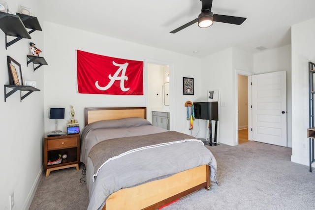 bedroom featuring ceiling fan, carpet, and ensuite bath