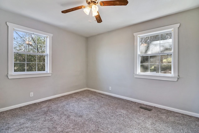 unfurnished room featuring carpet and ceiling fan