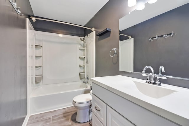 full bathroom featuring toilet, vanity, and washtub / shower combination