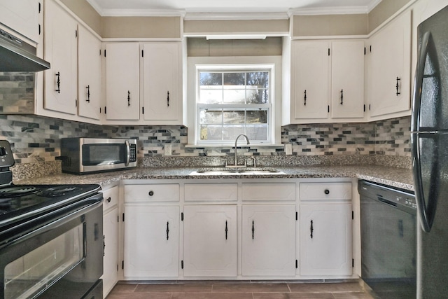 kitchen with sink, white cabinets, tasteful backsplash, and black appliances