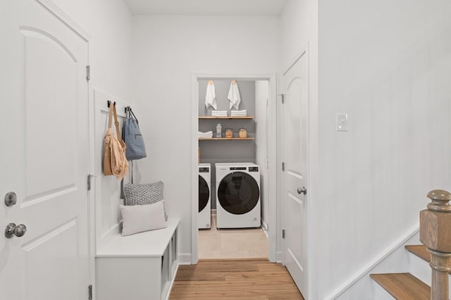 washroom with light wood-type flooring and independent washer and dryer