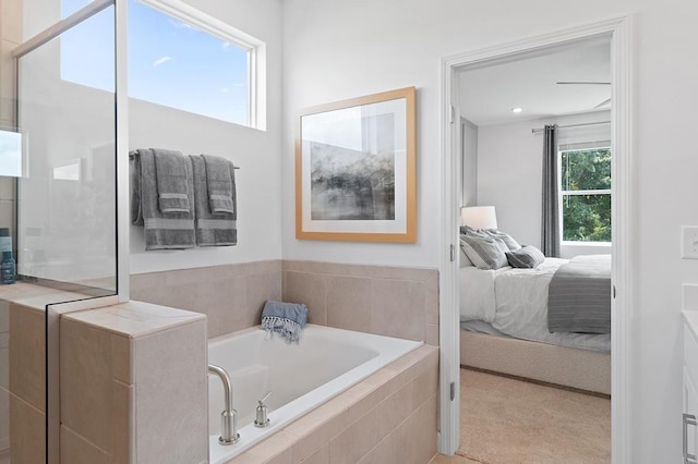 bathroom featuring tiled bath