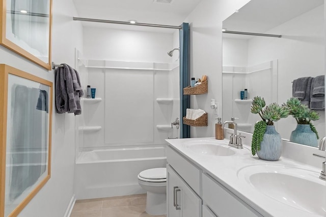 full bathroom featuring washtub / shower combination, tile patterned floors, vanity, and toilet