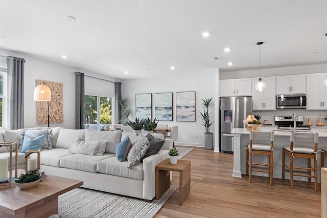 living room featuring light wood-type flooring