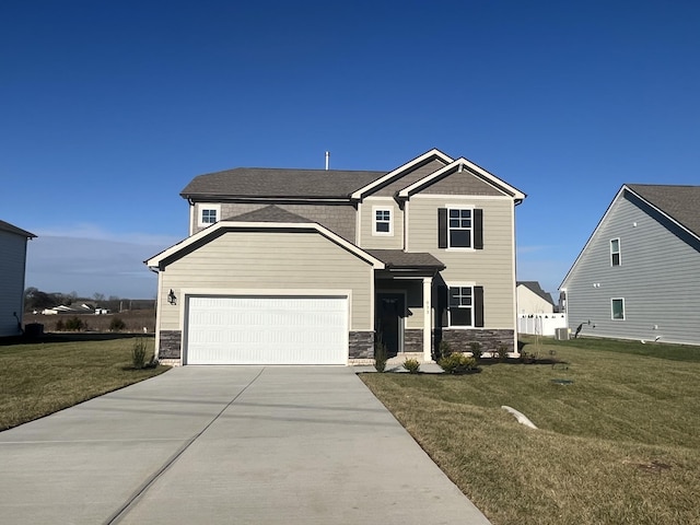 view of front of home featuring a garage and a front lawn