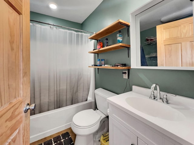 full bathroom featuring toilet, vanity, and shower / tub combo with curtain