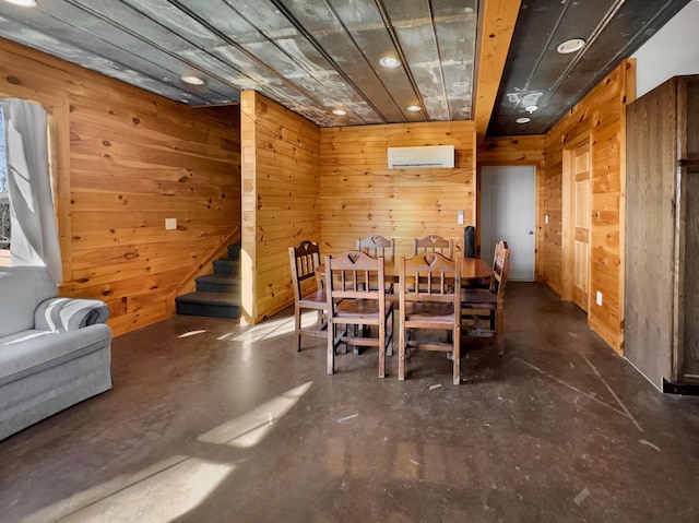 dining space featuring a wall mounted AC and wooden walls