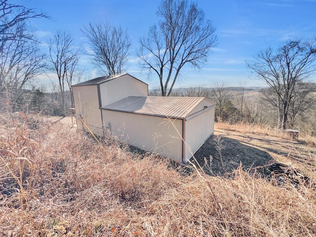 view of property exterior featuring a rural view