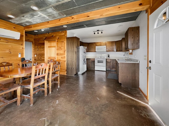 kitchen featuring an AC wall unit, sink, white appliances, and wood walls