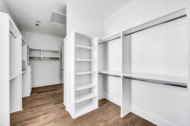 walk in closet featuring hardwood / wood-style floors