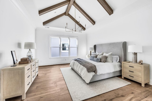 bedroom featuring beam ceiling, high vaulted ceiling, an inviting chandelier, and hardwood / wood-style floors