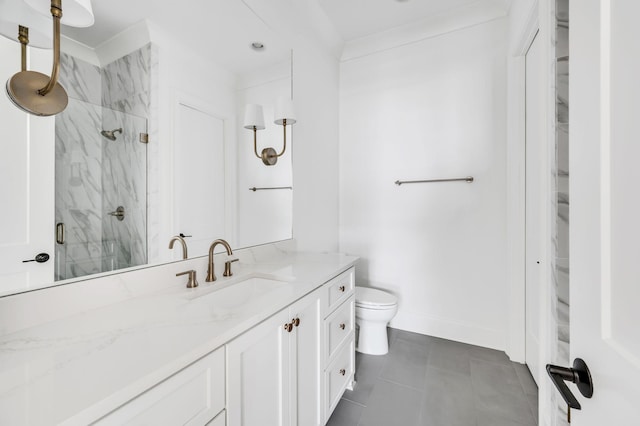 bathroom featuring tile patterned floors, an enclosed shower, vanity, and toilet