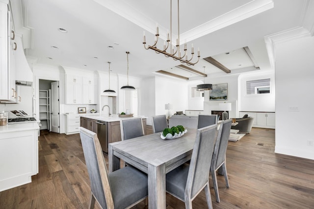 dining area with sink, dark hardwood / wood-style flooring, and crown molding