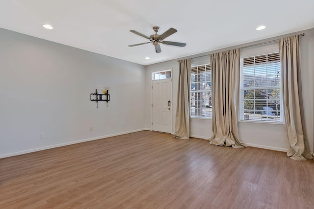 interior space featuring light wood-type flooring and ceiling fan