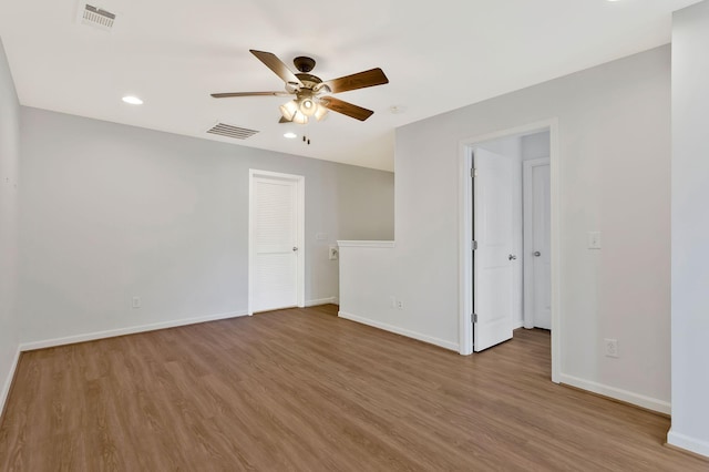 unfurnished room featuring light hardwood / wood-style floors and ceiling fan