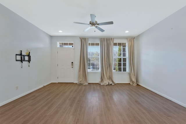 foyer featuring ceiling fan and light hardwood / wood-style floors