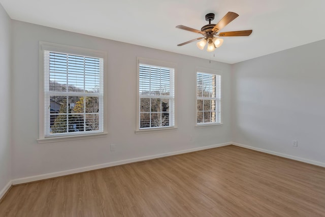 unfurnished room with ceiling fan and light hardwood / wood-style floors