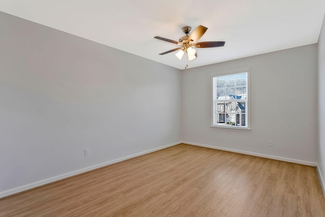 spare room featuring ceiling fan and light hardwood / wood-style floors