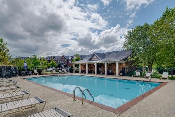 view of swimming pool featuring a patio area