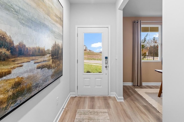 doorway with light wood-type flooring