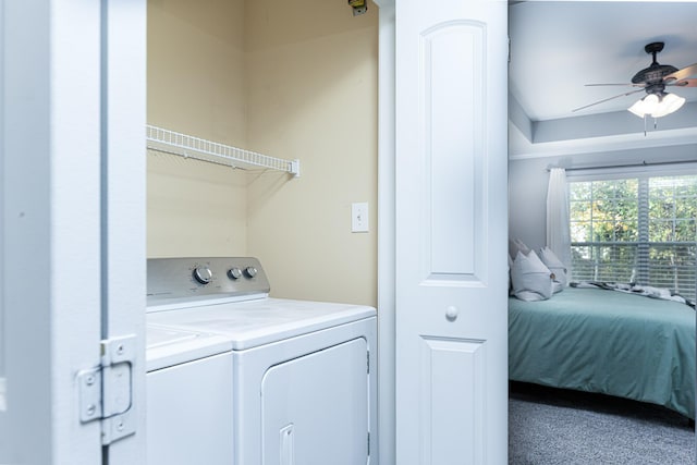 laundry area featuring ceiling fan, washing machine and clothes dryer, and carpet flooring