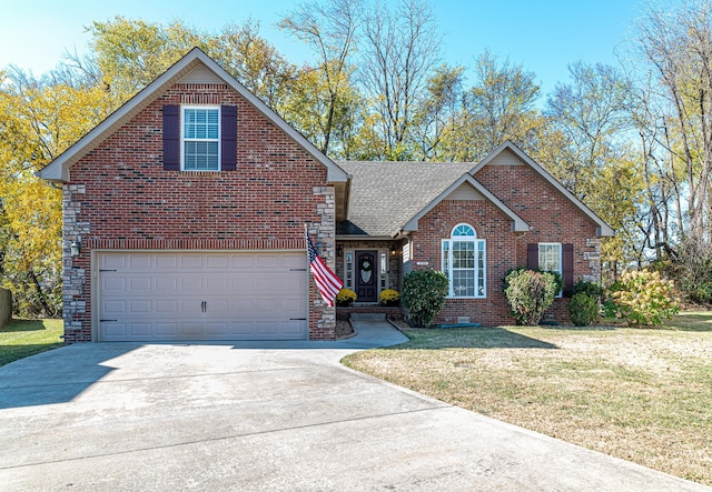 view of front property featuring a front yard and a garage