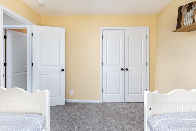 carpeted bedroom with a closet