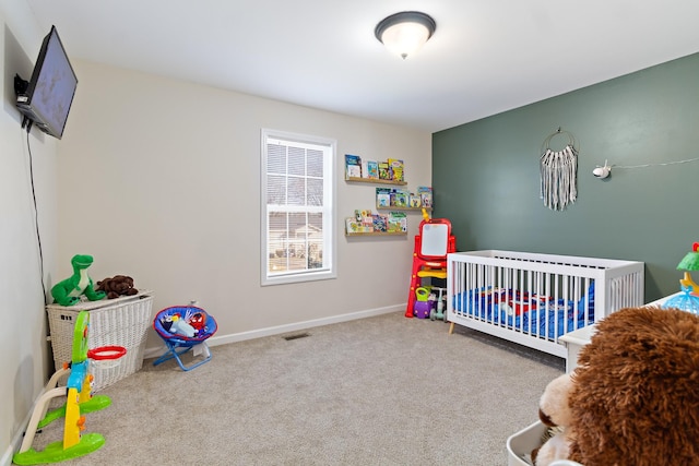 carpeted bedroom with a crib