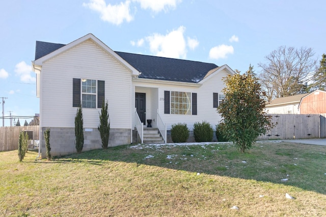 ranch-style house featuring a front lawn