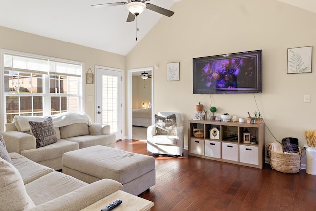 living room featuring ceiling fan, dark wood-type flooring, and vaulted ceiling