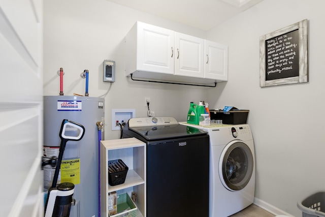 laundry room featuring cabinets, electric water heater, separate washer and dryer, and light tile patterned flooring