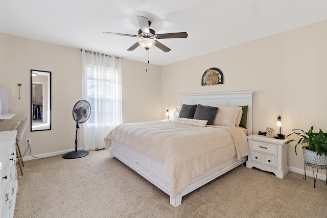 bedroom with light carpet and ceiling fan