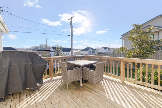 wooden deck featuring grilling area