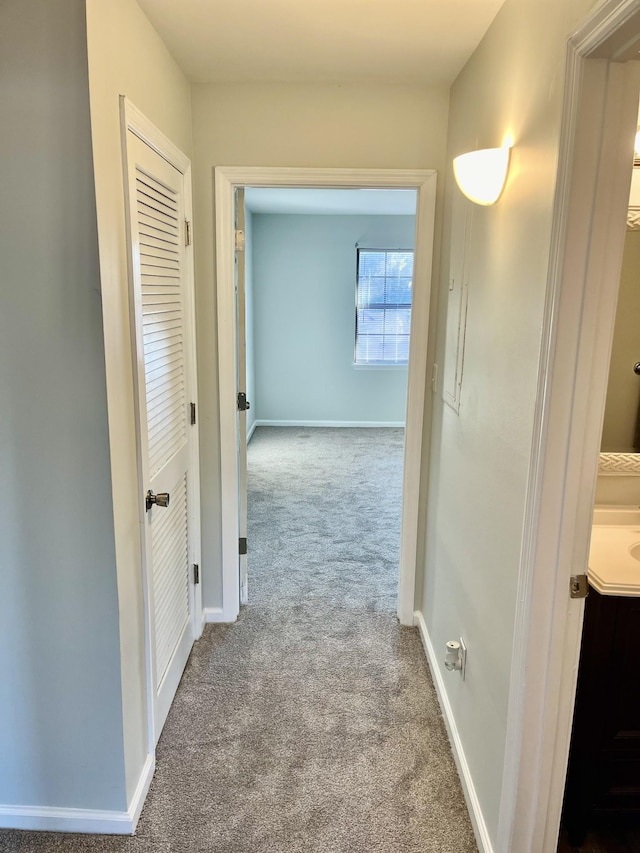 hallway with light carpet