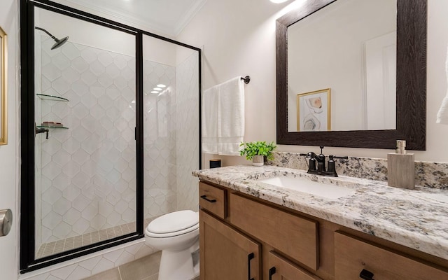 bathroom featuring walk in shower, vanity, toilet, tile patterned floors, and ornamental molding