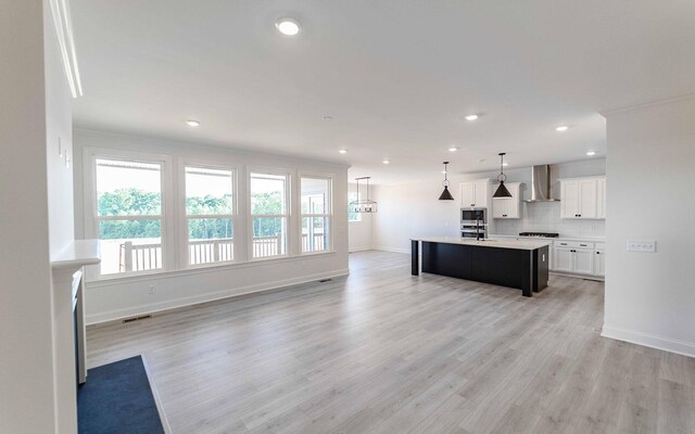 7934 Pine St, Fairview, TN 37062 - kitchen with wall chimney range hood, tasteful backsplash, light countertops, baseboards, and recessed lighting