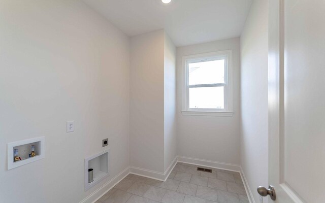 7934 Pine St, Fairview, TN 37062 - laundry room with electric dryer hookup, hookup for a washing machine, baseboards, and light tile patterned floors