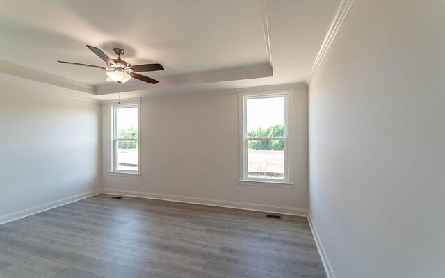 7934 Pine St, Fairview, TN 37062 - unfurnished room featuring crown molding, a raised ceiling, wood finished floors, baseboards, and ceiling fan