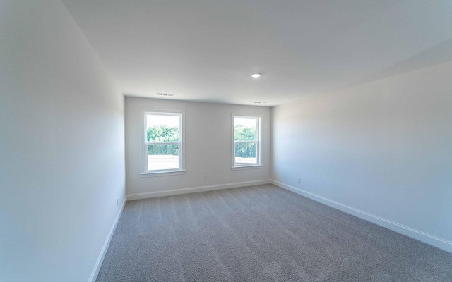 7934 Pine St, Fairview, TN 37062 - spare room with baseboards, light carpet, and recessed lighting
