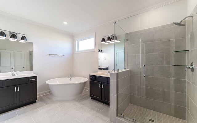 7934 Pine St, Fairview, TN 37062 - full bathroom with a shower stall, crown molding, two vanities, a soaking tub, and baseboards